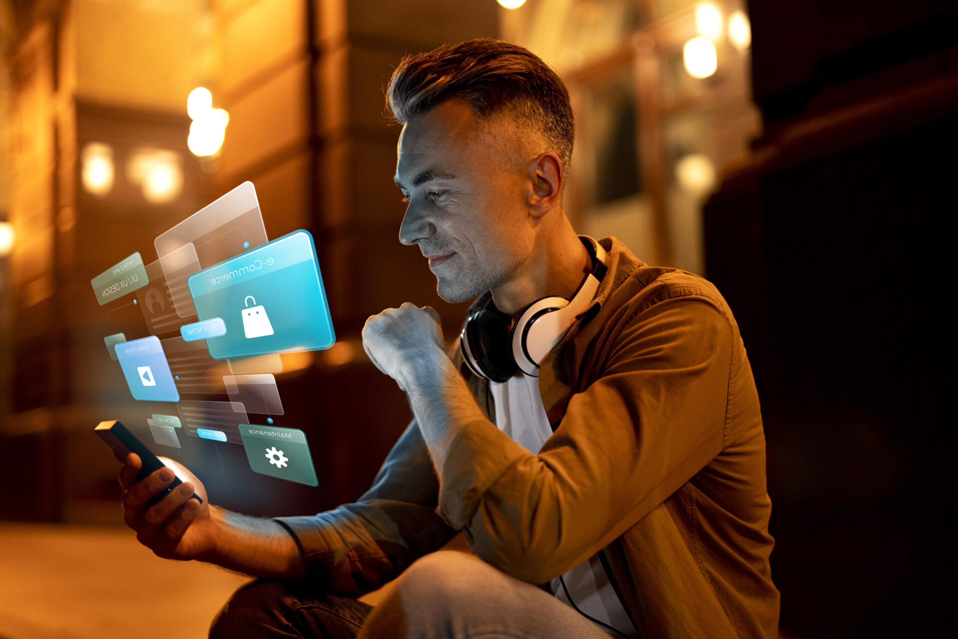 A man sitting on a street, looking at his mobile screen with various tabs related to mobile app designs, showcasing the integration of innovation into daily life.